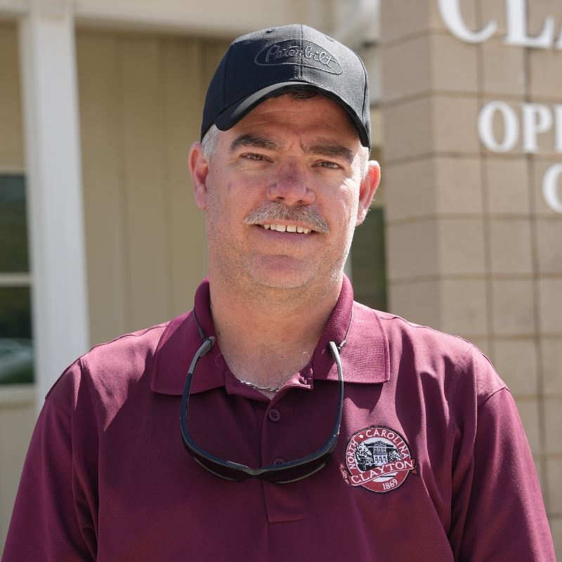 Rusty Clawson in front of Clayton Operations Center