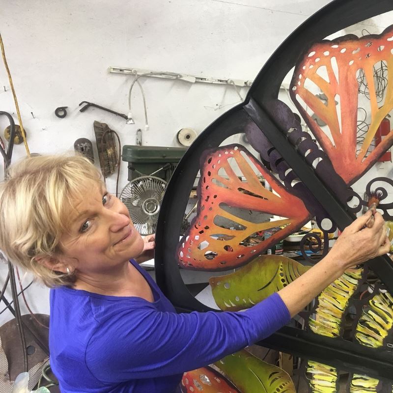 Grace Cathey paints a sculpture